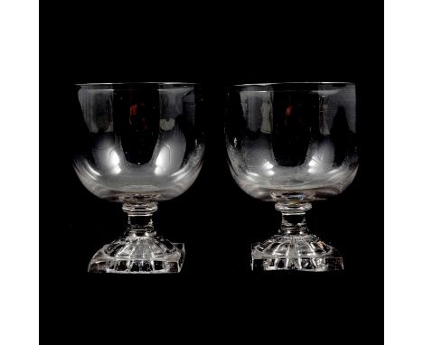 A pair of glass rummers, rounded cup bowls, top-knopped stems, square lemon-squeezer bases, 12cm.Condition report:1. no chips