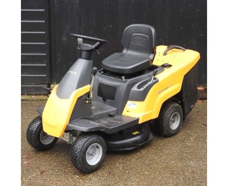 A Stiga yellow Combi 1066 HQ petrol ride-on lawnmowerLooks to be quite new with only very light signs of use. Removed from th