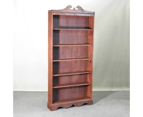 A pine standing open bookcase, with a swan neck pediment95w x 22d x 210h cmOverall complete and usable. Has been used so woul
