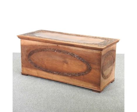 An early 20th century continental carved camphorwood blanket box, with a hinged lid120w x 51d x 53h cmOverall condition is co