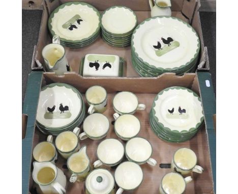 A Zeller fayencerie part tea and dinner service, painted with cockerels, within a green border