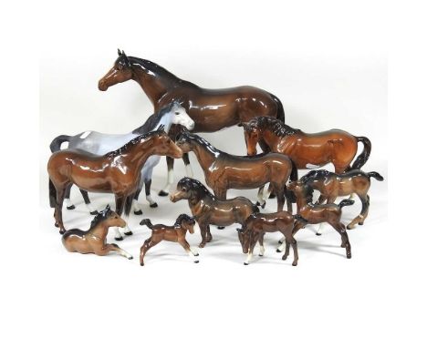 A large Beswick model of a horse, 29cm high, together with a collection of Beswick and other model horses