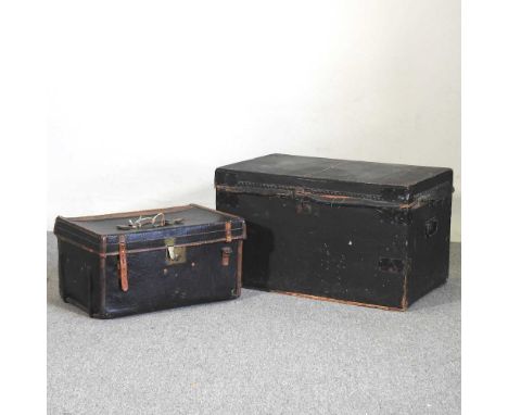 An early 20th century leather bound trunk bearing the initials A.V.C, together with another black trunk, 76cm wide (2)76w x 4