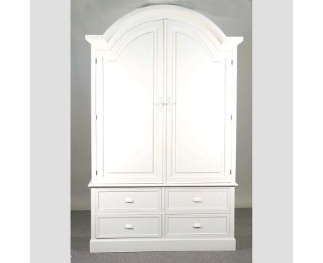A white painted armoire, fitted with shelves, with drawers below134w x 55d x 219h cmOverall complete and usable, but slightly