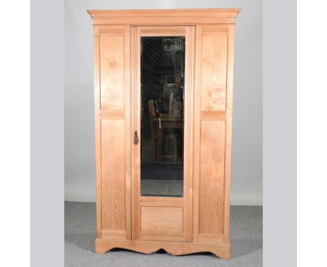 An Edwardian light ash single wardrobe, with a mirrored door116w x 44d x 195h cm