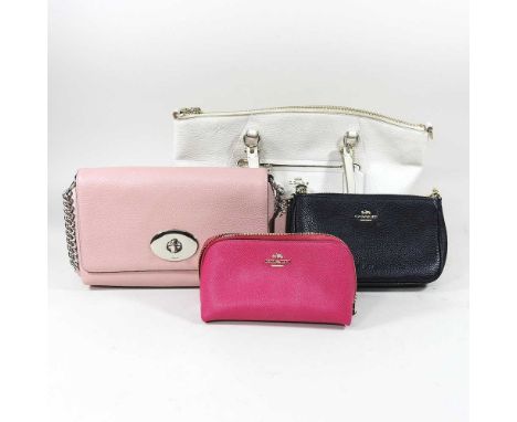 A pink leather Coach handbag, 24cm wide, together with a larger cream Coach handbag and two Coach purses (4)The cream bag has