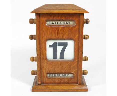 An early 20th century light oak desk calendar, 21cm highOverall condition is usable and complete. Dirty with some light marks
