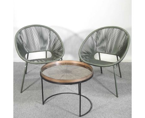 A pair of woven tub shaped spaghetti chairs, together with a bronzed occasional table, with a tray top, 61cm diameter (3)61 x