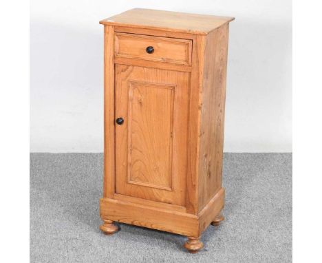A light elm bedside cupboard, containing a single drawer39w x 30d x 81h cm