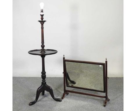 An early 20th century mahogany standard lamp, 120cm high, together with a 19th century swing frame toiletry mirror (2)