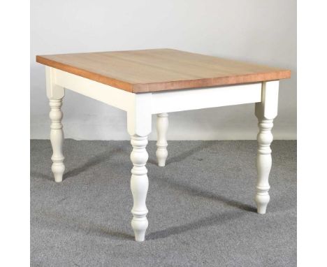 A modern light oak and white painted dining table, on turned legs122w x 92d x 78h cm