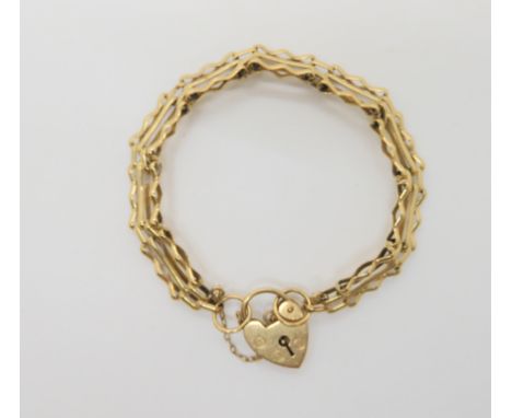 A 9ct gold gate bracelet with heart shaped clasp, weight 10.5gms Condition Report: Available upon request