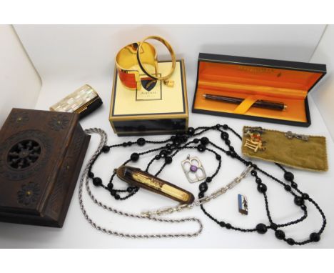 A mother of pearl Kigu compact a boxed bangle by Aspinal, a Hermes Bangle, a saucy Bakelite cheroot holder and other items Co