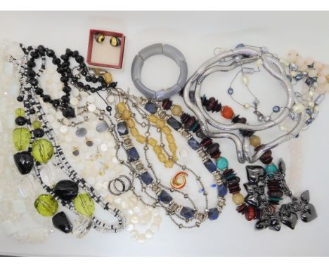 An agate bangle, and a collection of costume jewellery Condition Report: Not available for this lot