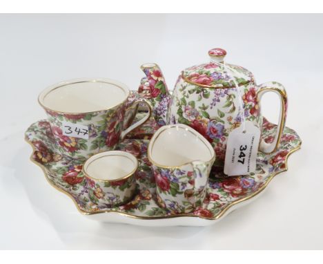 A Royal Winton 1995 Summertime chintz breakfast set comprising teapot, cup, milk jug, sugar bowl and toast rack on tray Condi