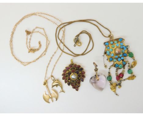 An amethyst heart pendant, a 9ct chain with a dolphin pendant, also with a 14ct gold axe pendant, and two Indian gem set pend