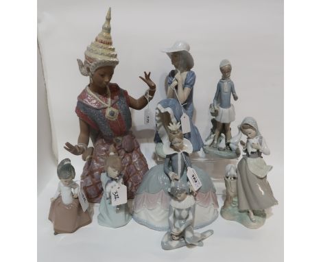 A collection of Lladro figures including Balinese Dancer, Princess and Pierrot, Girl and Doves, Girl and Geese and two small 