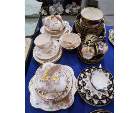 A Plant Tuscan teaset, the pink ground with flower decoration, comprising eight cups, twelve saucers and plates, two cake pla