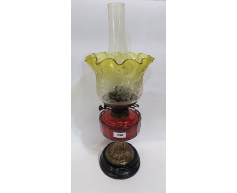 A Victorian oil lamp with cranberry reservoir and etched yellow shade, 43cm high Condition Report: Available upon request