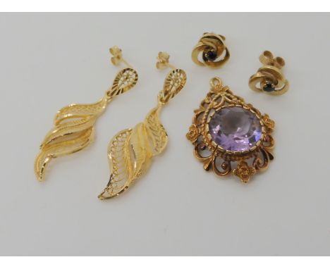 A 9ct gold amethyst pendant (needs bail) a pair of 9ct filigree earrings and a pair set with sapphires weight combined 8.6gms