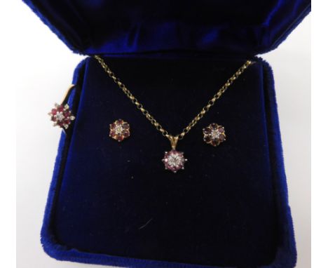 A 9ct gold diamond and ruby flower ring size R1/2, with matching earrings and a pendant weight together 4.6gms Condition Repo