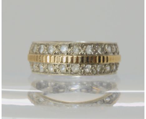 A 9ct white gold wide wedding ring with a double row of clear gems, size K, weight 4.6gms Condition Report: Available upon re
