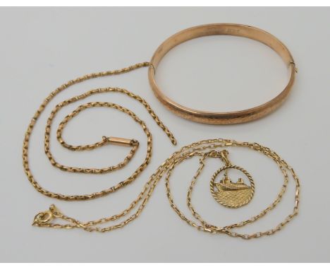 A 9ct gold bangle, a 9ct gold chain with Canberra ship pendant and a yellow metal chain (af) weight combined 18.6gms Conditio