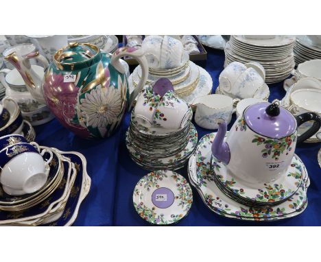 A Crown Staffordshire teaset with colourful peacock feather style decoration comprising teapot, two cake plates, twelve plate