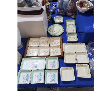 A collection of Clarice Cliff for Wilkinsons Ltd hors d'oeuvre dishes with decorations of fish, flowers and trees Condition R