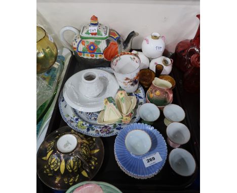 A Bavarian porcelain cup and saucer, with silvered decoration, a Japanese elephant teapot, a Royal Worcester four pot spill v