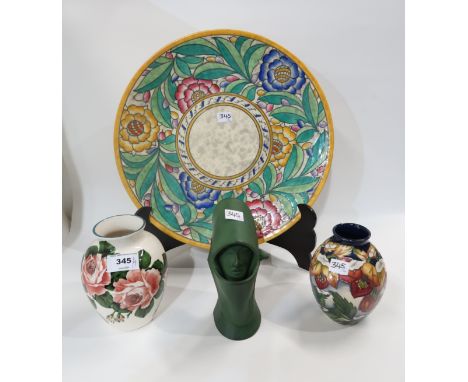 A Griselda Hill Wemyss cabbage rose vase, a Moorcroft Hellebore vase, a Charlotte Rhead for Crown Ducal plate and a green gla