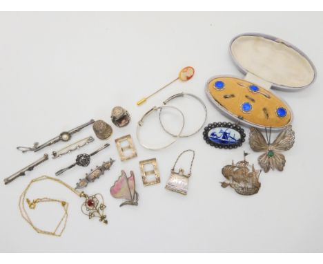 A set of white metal and enamel buttons and a brooch, silver bangles, a silver and mother of pearl butterfly brooch by Duncan
