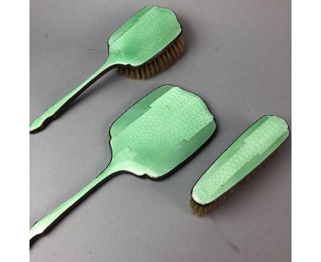 SILVER AND GREEN GUILLOCHE ENAMEL PART DRESSING TABLE SET, comprising hand mirror and two brushes (3)