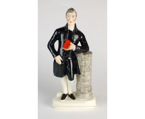 A Staffordshire figure of the 'Rev John Elies' (sic) (1744-1841), 19th century, modelled standing leaning against a pillar we
