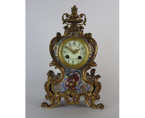 An early 20th century French eight day champleve enamel Louis XV style mantel clock the 3 inch enamel dial with Arabic numera