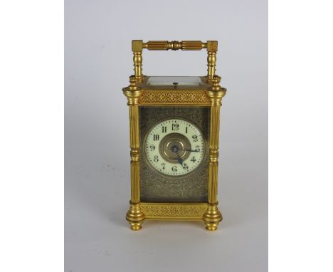 A late Victorian repeating carriage clock, the 2.25 inch enamel chapter ring of Arabic numerals in an architectural case with