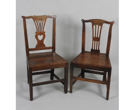 A group of five late George III oak country Chippendale dining chairs comprising of three examples with pierced vase shaped b