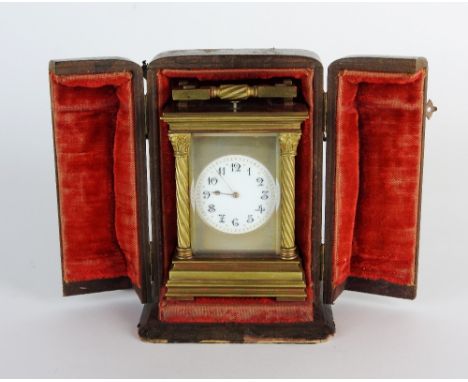 A late 19th century French repeating carriage clock, the circular enamel dial with ring of Arabic numerals, the back plate st