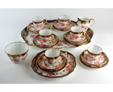 A Royal Crown Derby tea service, pattern 2649, early 20th century, comprising six cups, saucers and sideplates, a sugar/waste