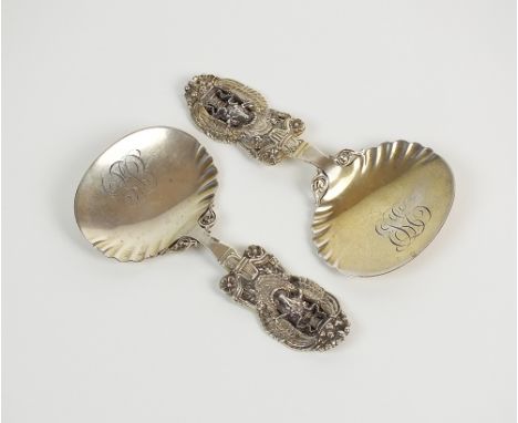 A pair of Tiffany & Co Sterling silver caddy spoons, each with stylised handle in the form of a mythical creature, engraved i