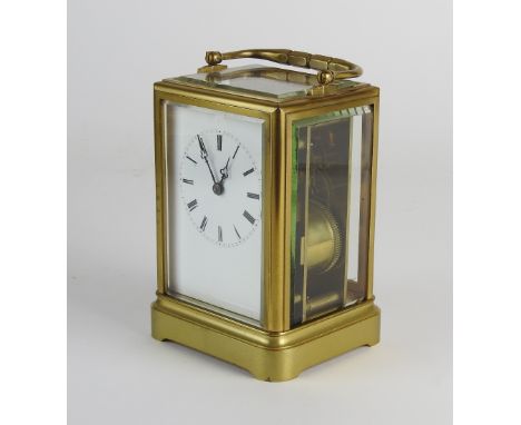 A late 19th century French carriage clock, the 2.5 inch white enamel dial with ring of Roman numerals, in a five glass case w