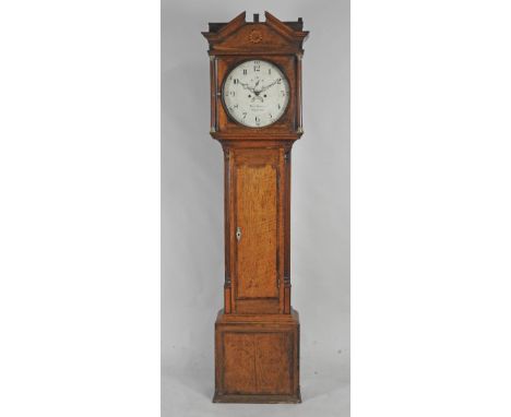 A late George III oak eight day longcase clock the14 inch circular dial sighed Thos. Benbow, Northwood with centre subsidiary