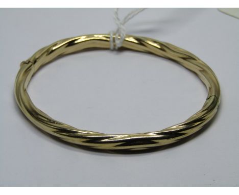 9ct YELLOW GOLD HINGED BANGLE of twist form, 12grams 