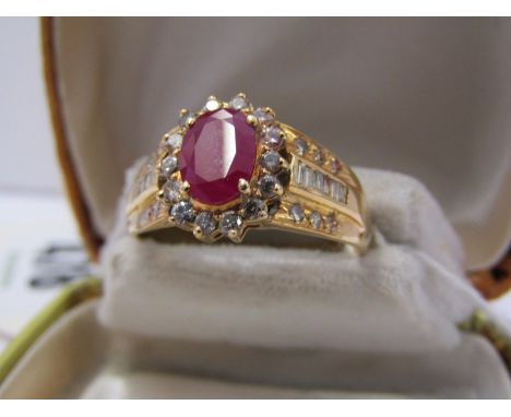 14ct YELLOW GOLD RUBY &amp; DIAMOND CLUSTER RING, central oval cut ruby surrounded by brilliant cut diamonds with mixed bague