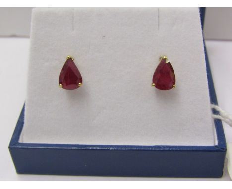 PAIR OF 18ct YELLOW GOLD RUBY EARRINGS, of pear form, each stone approx 9mm long 6.3mm at widest point, on 18ct yellow gold b