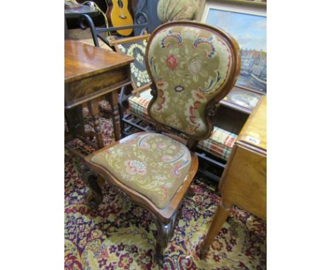 VICTORIAN SIDE CHAIR; A Victorian rosewood framed side chair on carved cabriole legs with floral tapestry seat and back 