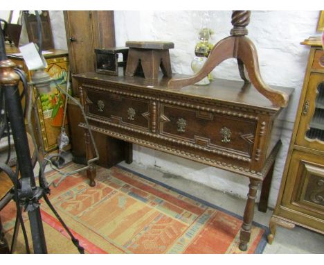CROMWELLIAN DESIGN DRESSER, geometric fielded design twin drawer dresser with brass axe drop handles, 50" width 