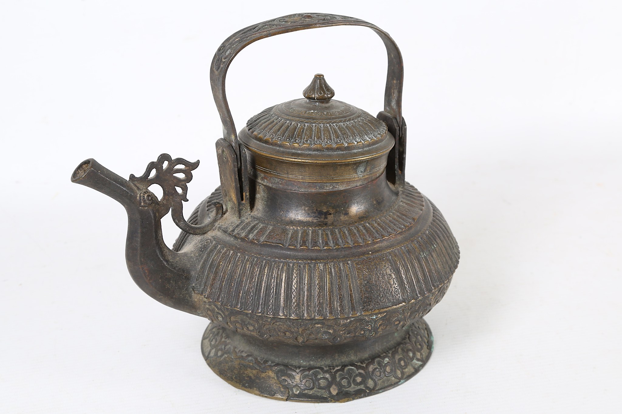 A 19th Century bronze Malay teapot with ribbed detail to body and lid.
