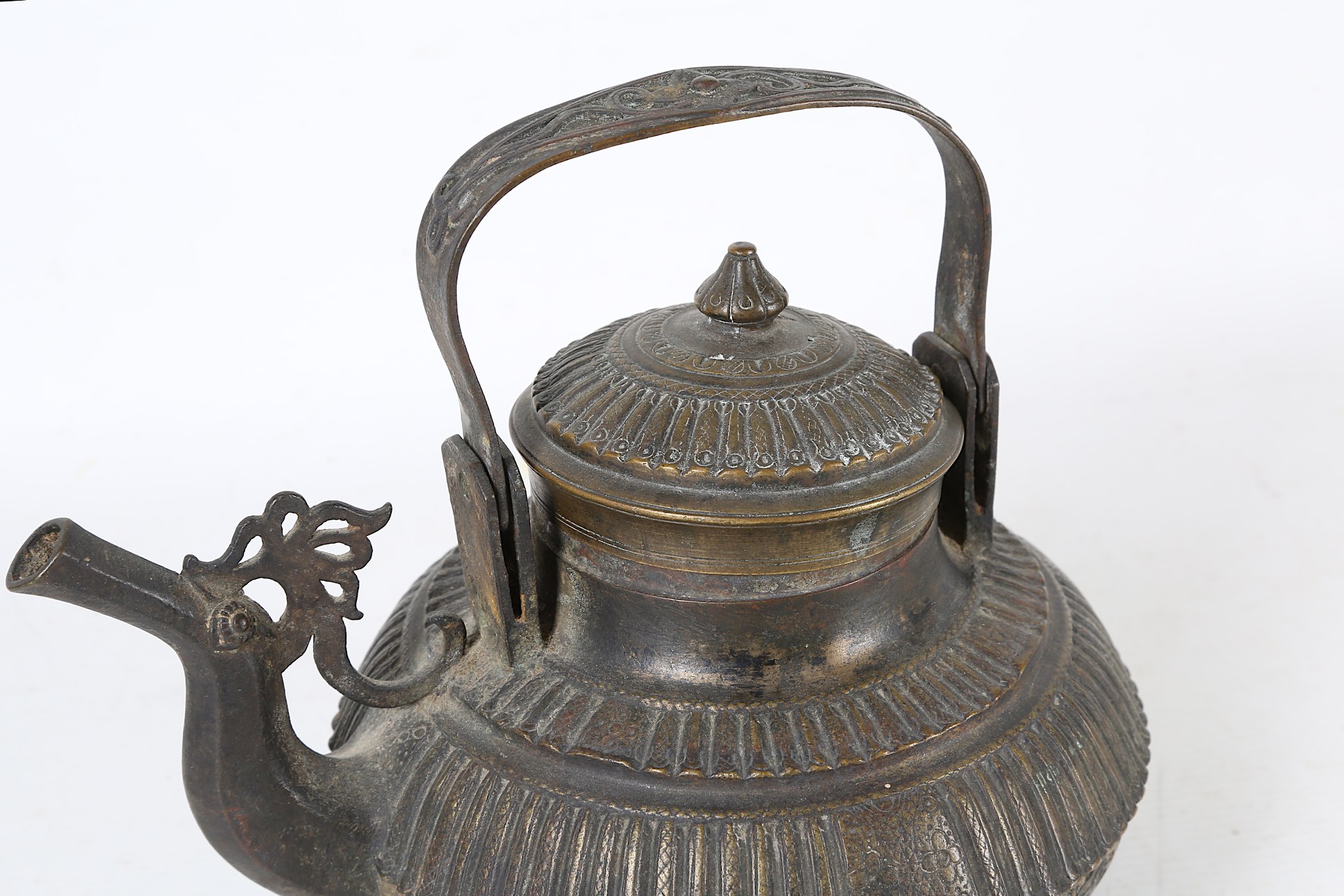 A 19th Century bronze Malay teapot with ribbed detail to body and lid.