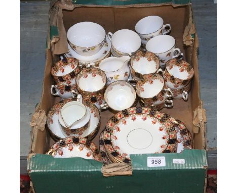 A box containing a Colclough part tea service along with a Stanley china part tea service.